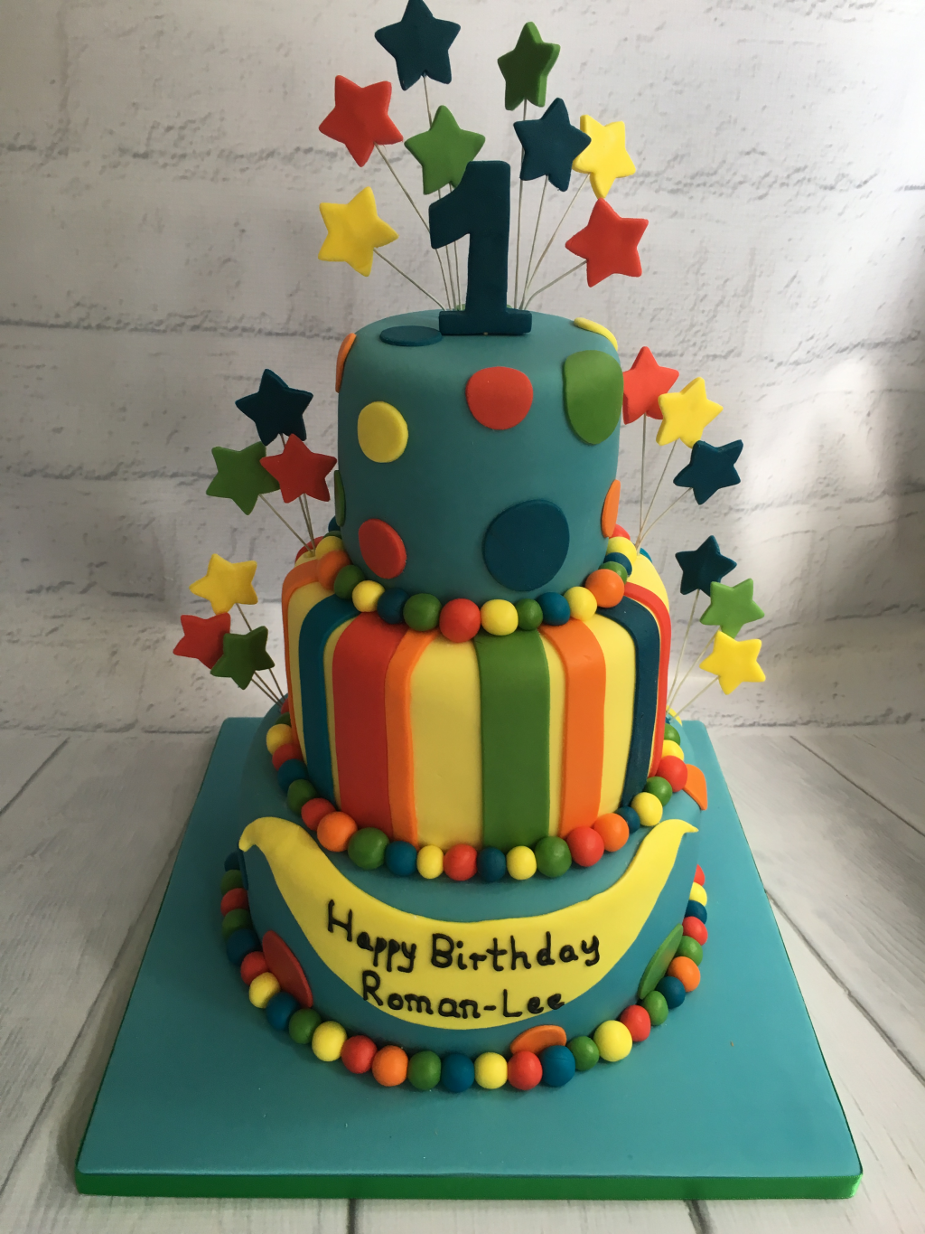Multicoloured-first-birthday-cake